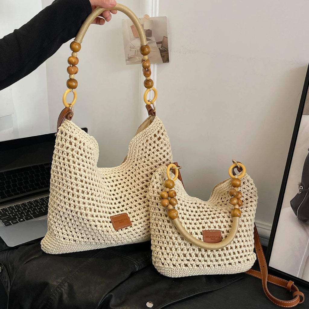 Knitted bucket tote beach bag with contrast stitching and zippered interior compartment