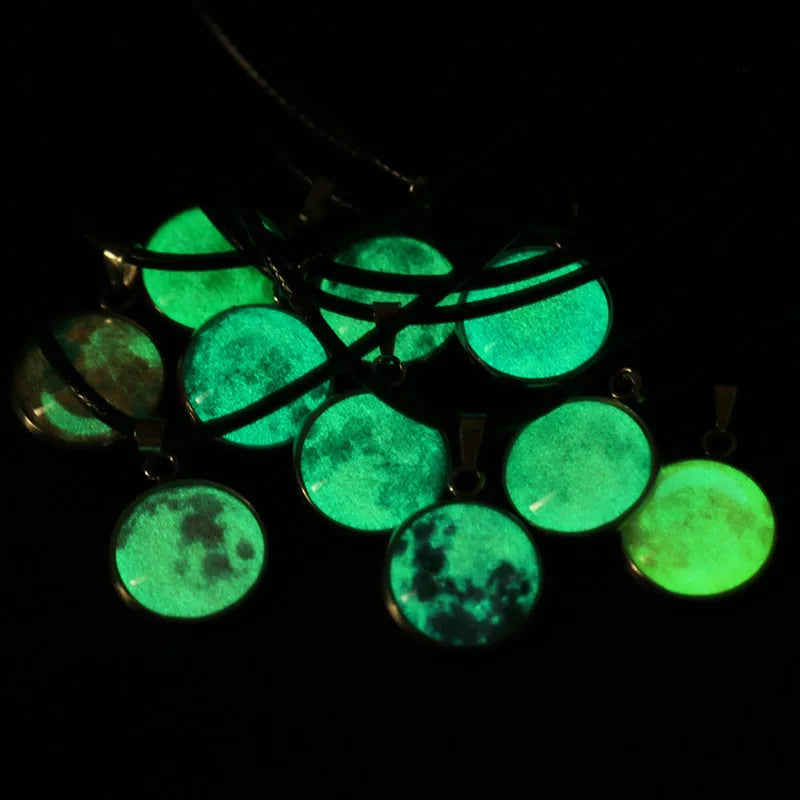 Luminous Christmas moon and night sky pendant necklace with adjustable chain on display