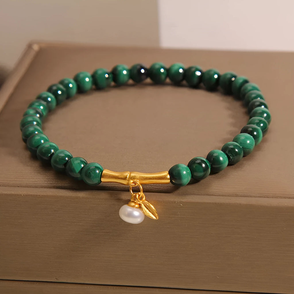Women's adjustable lucky bamboo bracelet with white crystal detailing on wrist