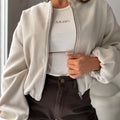 Milky White women's off-shoulder jacket with round neck and long lantern sleeves, loose casual fit.