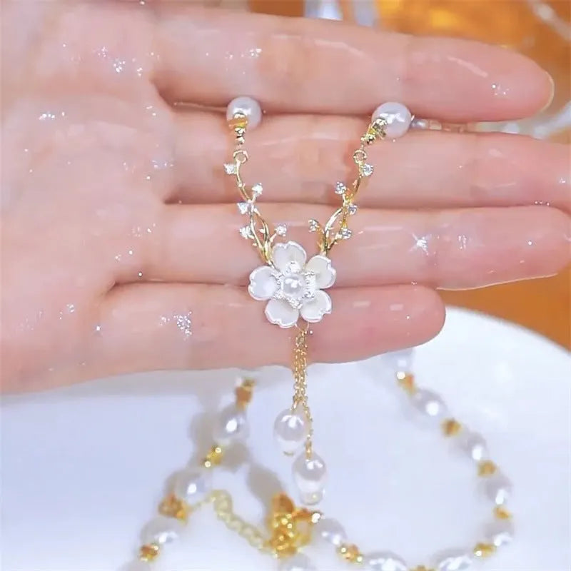 Alloy pearl chain necklace with floral and rose decorative elements in pearl flower colour