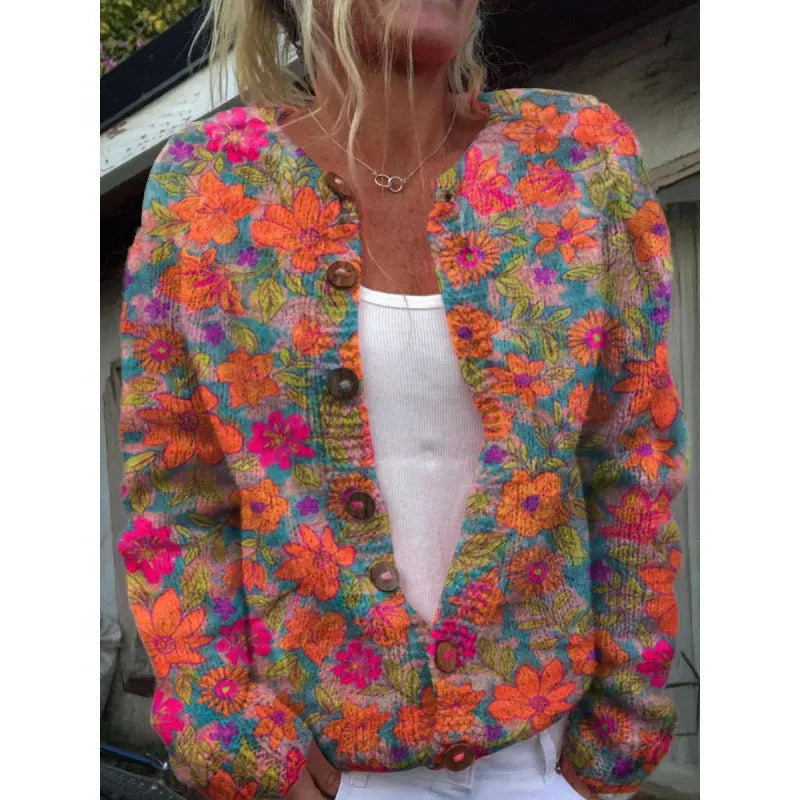 Yellow cardigan coat with a raised 3D pattern, shown on a hanger.
