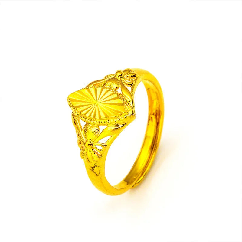 Geometric gold flower ring with open setting and textured details on brass base