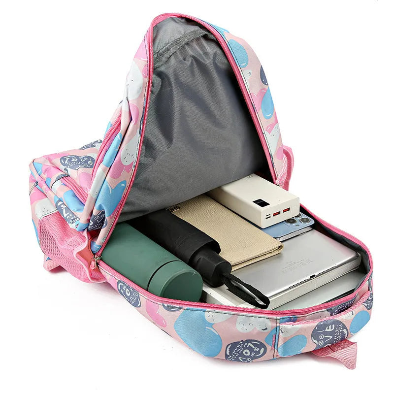 Blue children's Oxford cloth school backpack with large main compartment and padded air-pillow shoulder straps.
