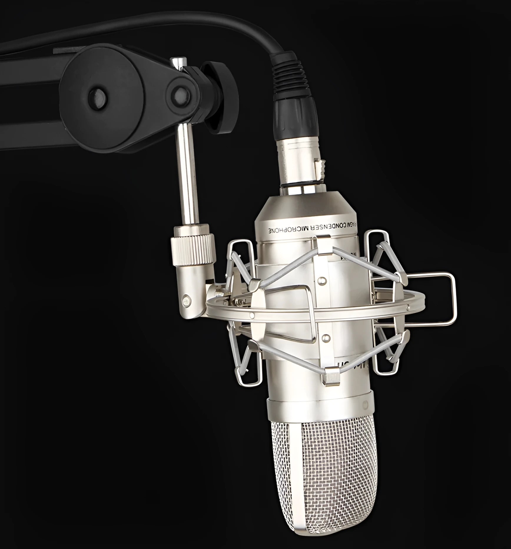 MC001 professional condenser microphone with gold-plated diaphragm, shock mount, and windshield on desk setup