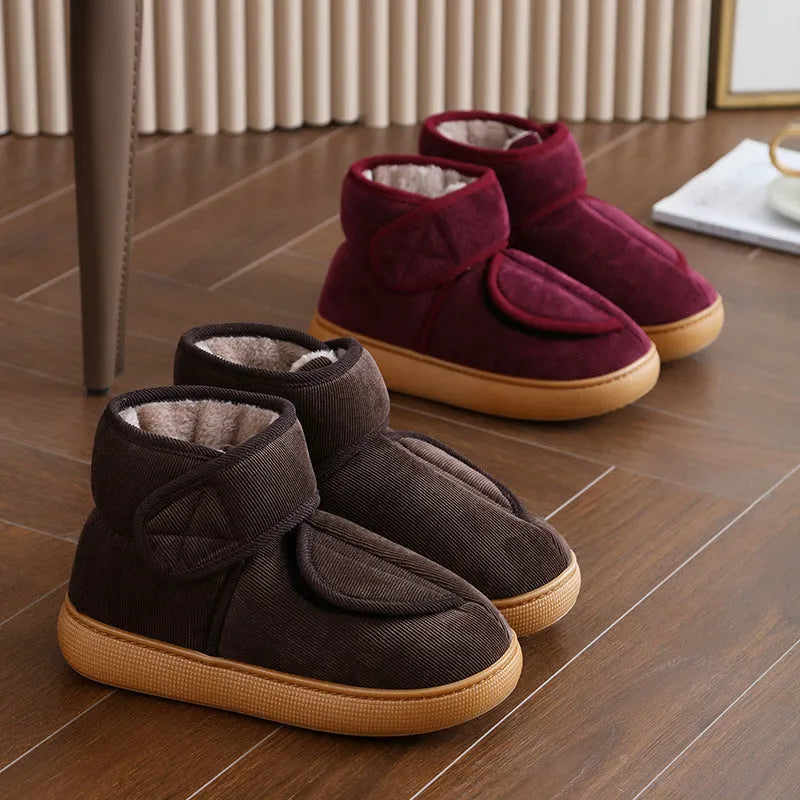Large opening warm boots with anti-slip rubber soles, unisex slip-on design, plush upper and faux fur lining in black