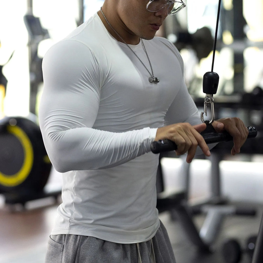 Men's black fitness tights with long sleeves slim fit for running and gym workouts