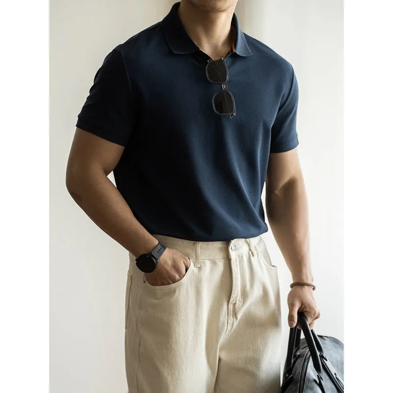 American-style light blue cotton blend short-sleeve polo shirt laid flat, showing regular fit and button placket.