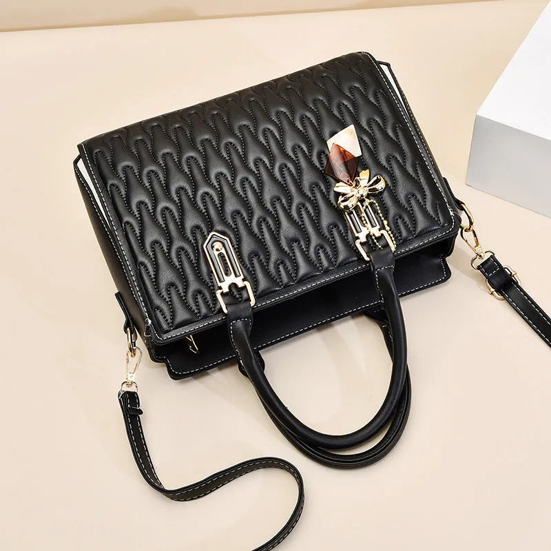 Women's black large-capacity shoulder messenger bag with an external sandwich pocket.