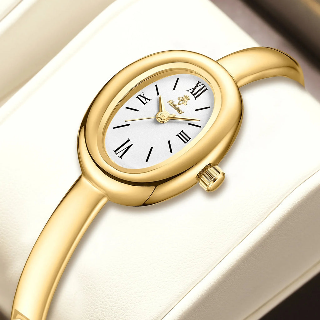 Women's oval-faced retro quartz watch in gold colour with slim 8mm profile